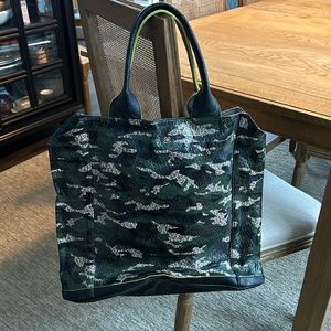 Punchcase bag with shoulder strap and handles and mobile device charger